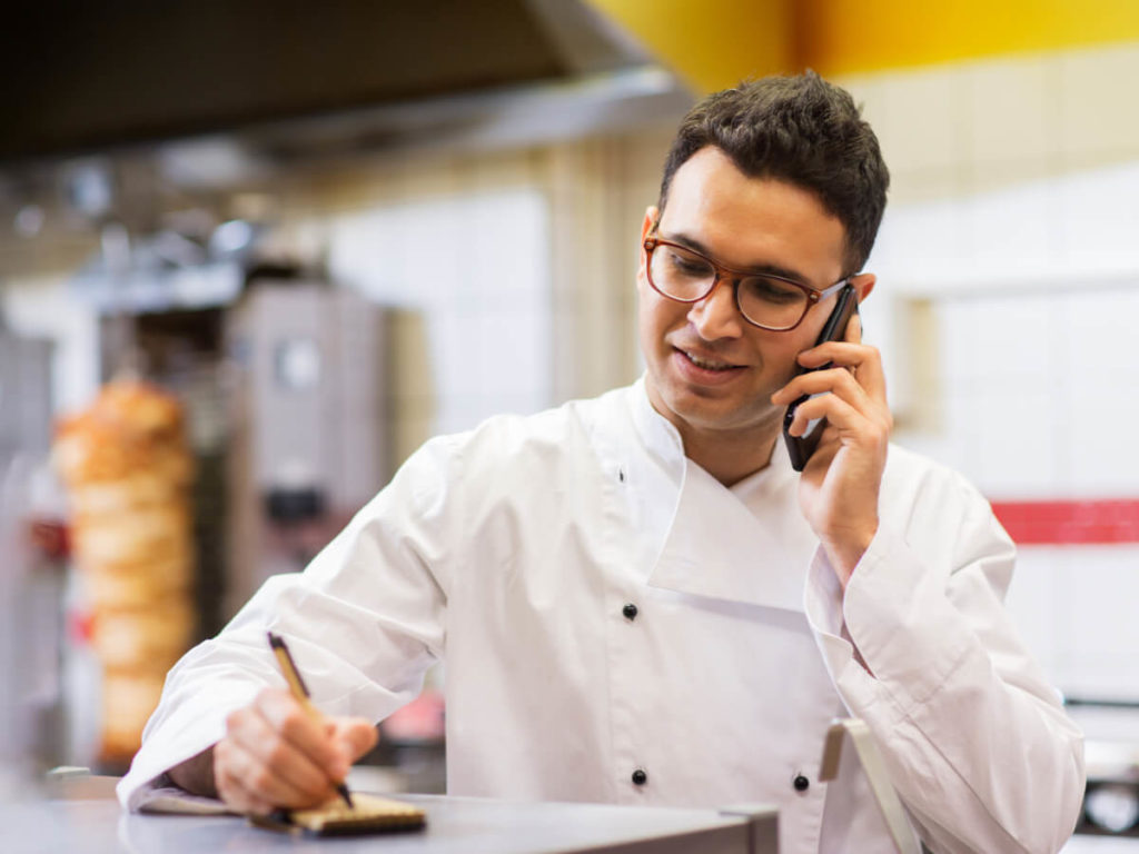 Commercial food service employee frying food