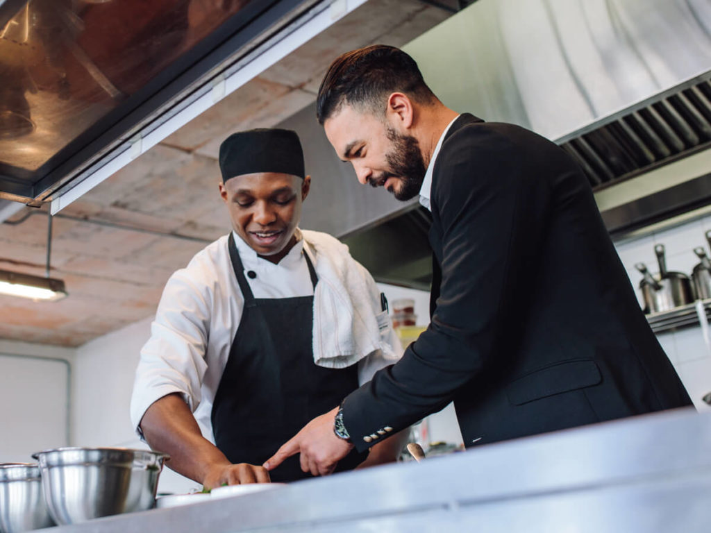 PHT Systems employee training a commercial food service employee